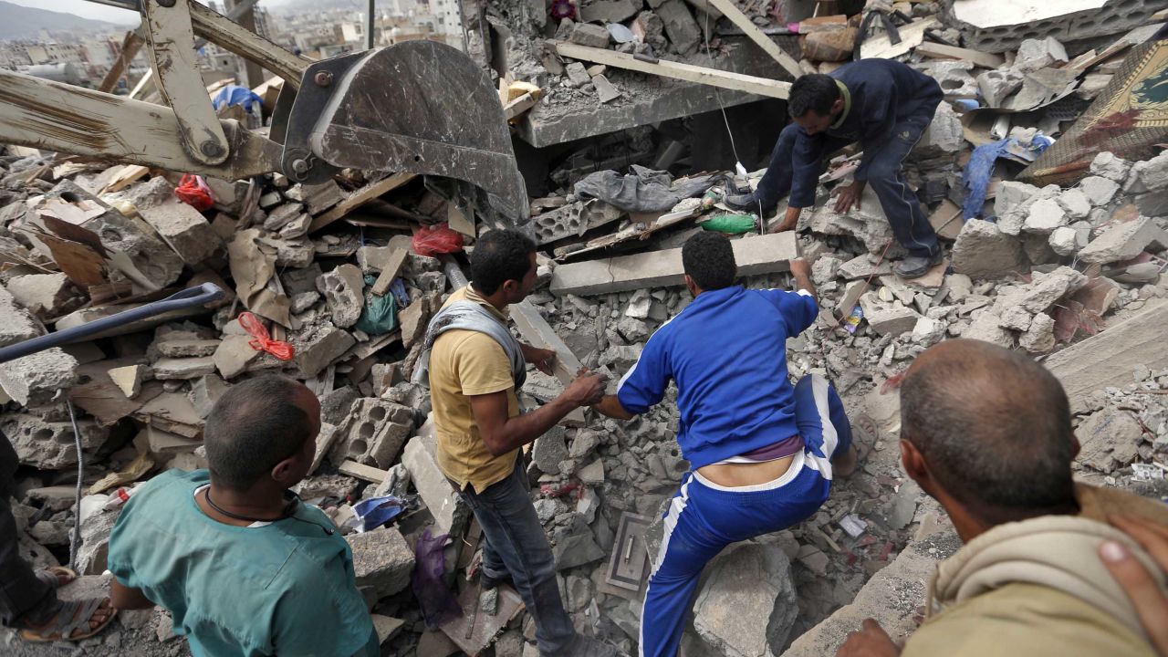 Yemenis search under the rubble of a house destroyed in Friday's airstrike. 