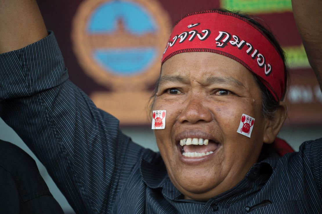 A supporter of former Thai Premier Yinluck Shinawatra shouts as she and others wait for her arrival at the Supreme Court in Bangkok on August 25, 2017.