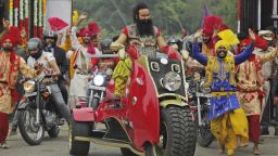 FILE- In this Wednesday, Oct. 5, file 2016 photo, Indian spiritual guru, who calls himself Saint Dr. Gurmeet Ram Rahim Singh Ji Insan, arrives for a press conference ahead of the release of his new film "MSG, The Warrior Lion Heart," in New Delhi, India.