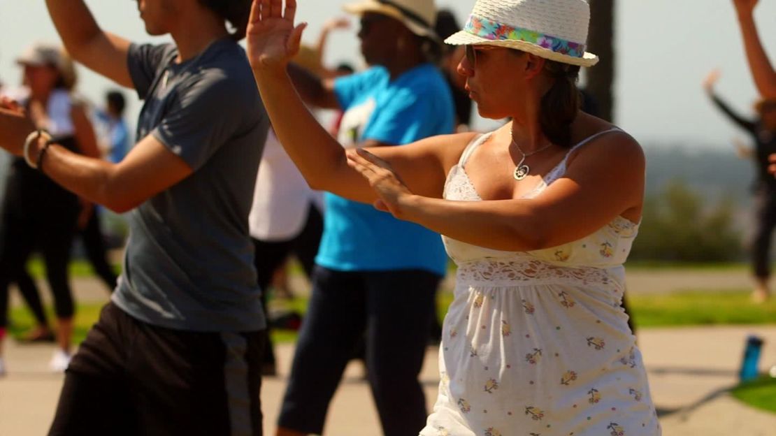 Taniela Irizarry, 37, takes a free tai chi class on Long Beach's Signal Hill.