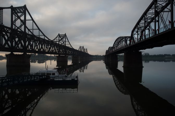 <strong>Northern link:</strong> The sun rises over the Friendship Bridge on the Yalu River, which links North Korea and China in the north. 