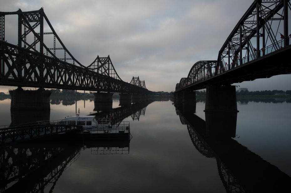 <strong>Northern link:</strong> The sun rises over the Friendship Bridge on the Yalu River, which links North Korea and China in the north. 