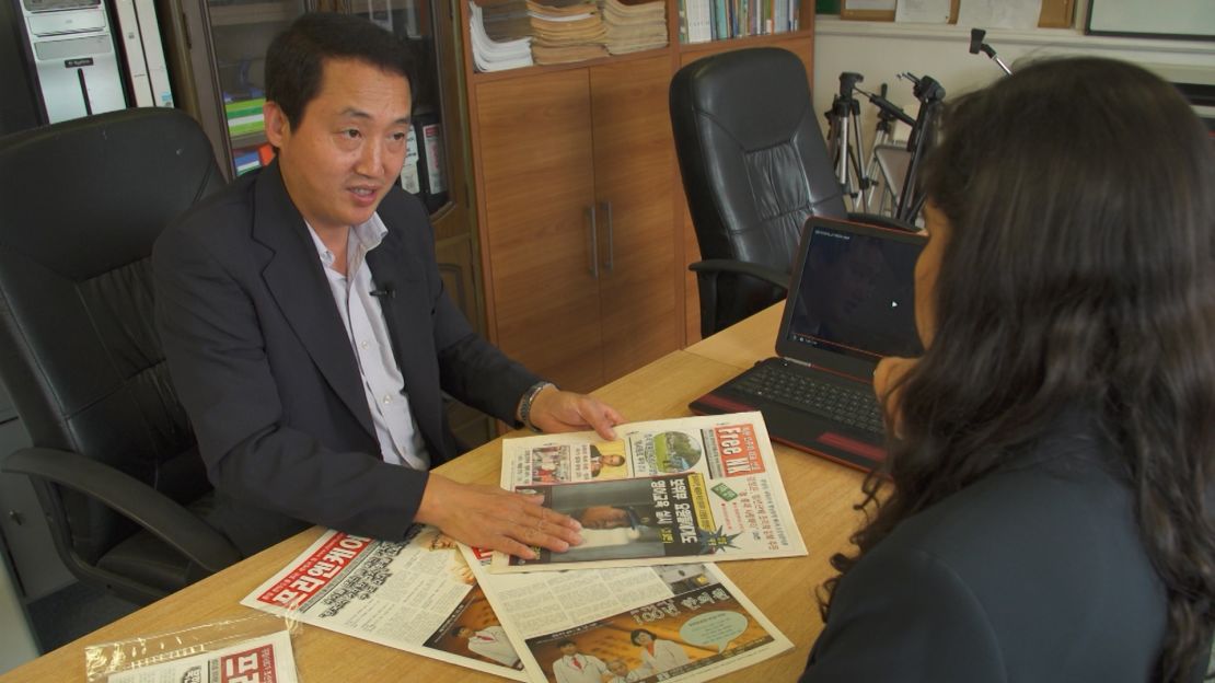 Joo Il Kim shows CNN a copy of Free NK.