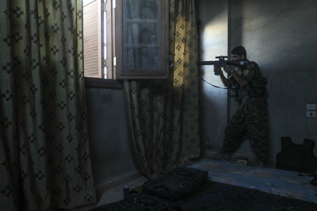 A SDF sniper targets Isis fighters in west Raqqa on August 25.