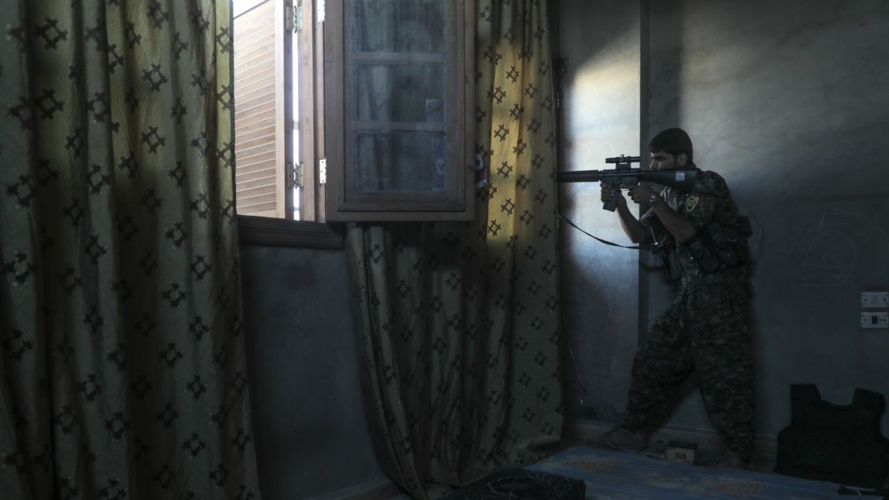 A SDF sniper targets Isis fighters in west Raqqa on August 25.