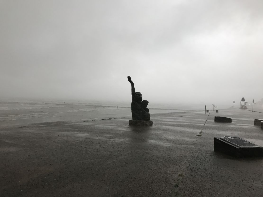 A memorial to the 1900 "Storm of the Century" is lashed by rain on August 26, as bands from Hurricane Harvey swipe Galveston, Texas.