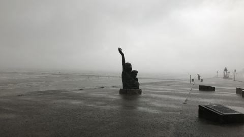 A memorial to the 1900 "Storm of the Century" is lashed by rain on August 26, as bands from Hurricane Harvey swipe Galveston, Texas.
