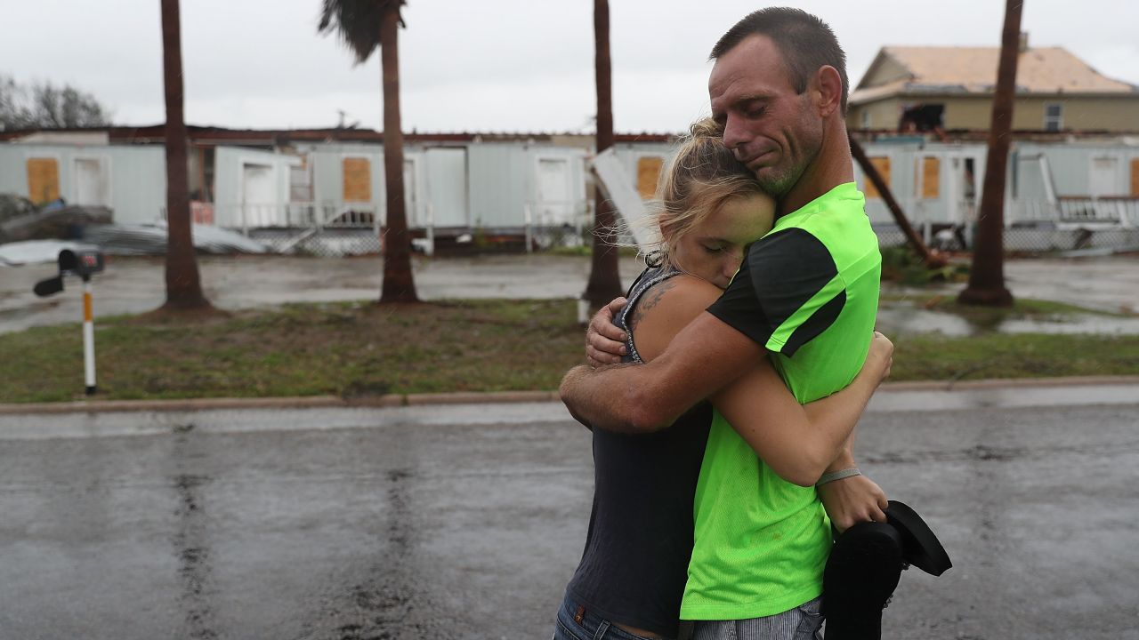Jessica Campbell hugs Jonathan Fitzgerald after riding out Hurricane Harvey in an apartment on August 26, 2017, in Rockport.