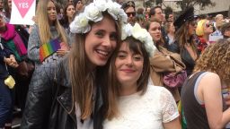 Jane Mahoney, 28, and Josie Lennie, 26, danced and kissed in front of the crowd after a celebrant officiated over a "mass illegal wedding" in Melbourne Saturday, August 26.