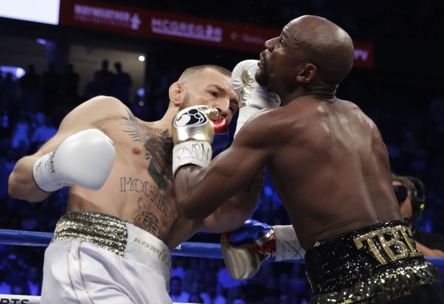 McGregor lands an uppercut early in the bout. He came out aggressive and took the fight to Mayweather in the first few rounds.