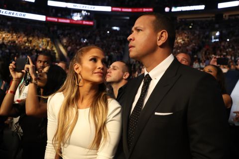 Actress Jennifer Lopez and her boyfriend, former baseball star Alex Rodriguez, take in the fight.