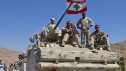 Lebanese army soldiers sit a top an armoured personnel carrier (APC) as they drive in the eastern town of Ras Baalbek, on August 21, 2017, upon returning from the mountainous frontline where an offensive against the Islamic State group on the country's eastern border with Syria after capturing a third of the territory IS held in the region. / AFP PHOTO / STRINGER        (Photo credit should read STRINGER/AFP/Getty Images)