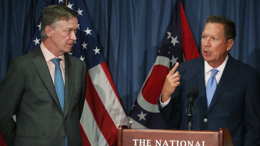 Gov. John Kasich (R-OH) (R) and Gov. John Hickenlooper (D-CO) participate in a bipartisan news conference to discuss the Senate health care reform bill at the National Press Club on June 27, 2017 in Washington, DC.
