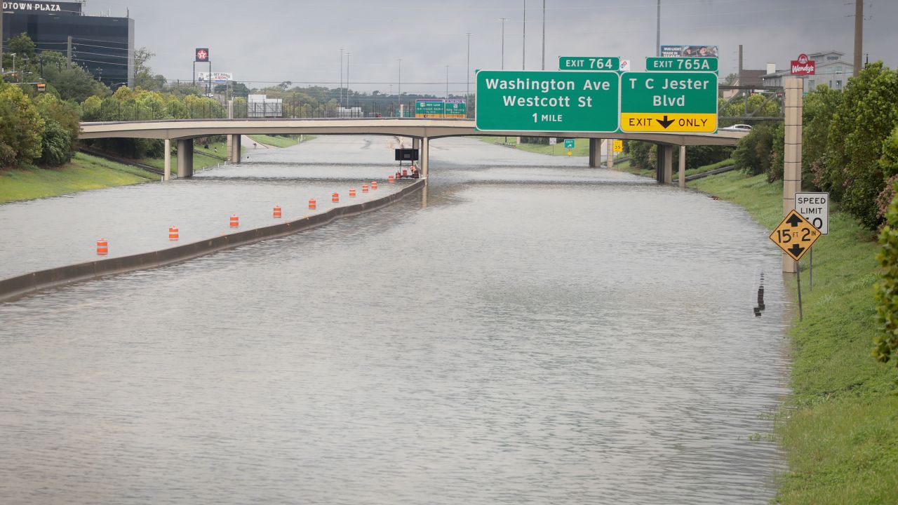 HOUSTON, TX - AUGUST 27:  Water flows down Interstate 10 which has been inundated with flooding from Hurricane Harvey on August 27, 2017 in Houston, Texas. Harvey, which made landfall north of Corpus Christi late Friday evening, is expected to dump upwards to 40 inches of rain in Texas over the next couple of days.  (Photo by Scott Olson/Getty Images)