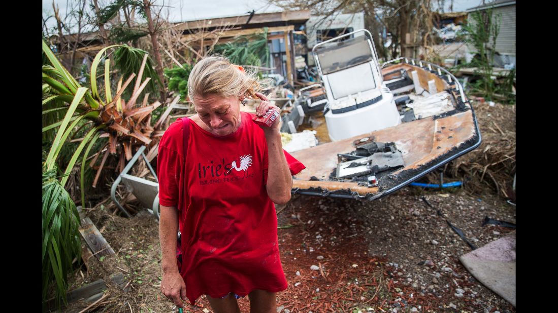 Melani Zurawski cries while inspecting her home in Port Aransas, Texas.