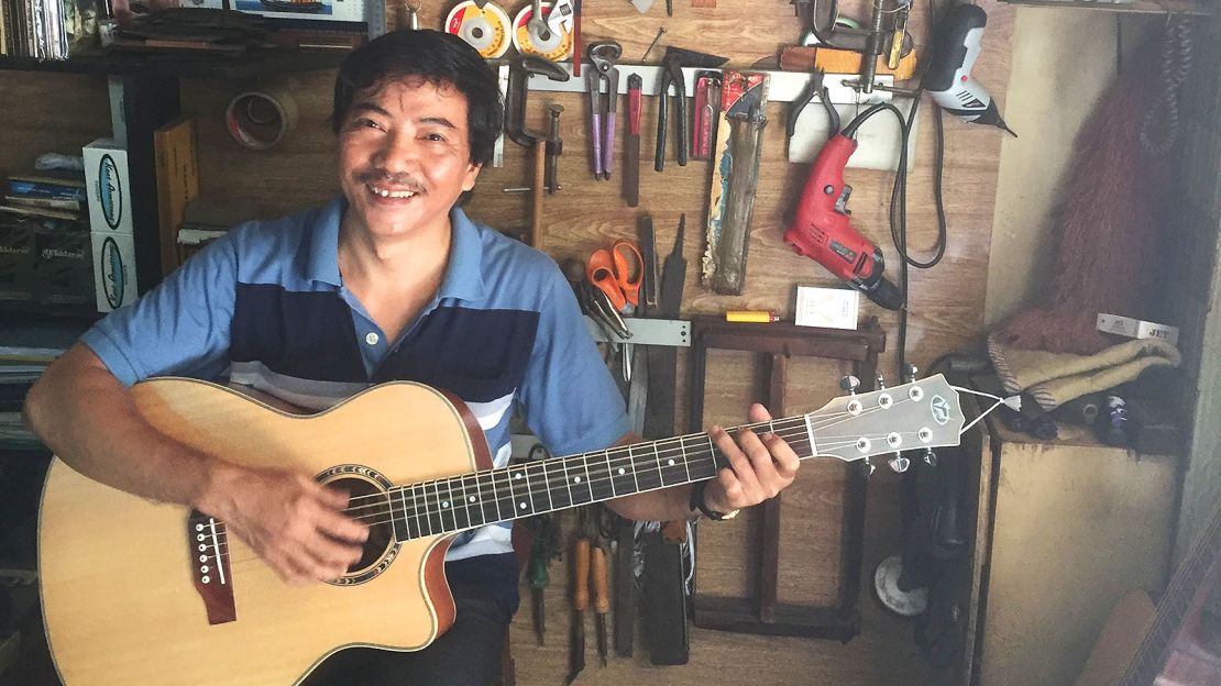 Ton That Anh, co-owner of Duy Ngoc Guitars, is wary of slipping standards on Saigon's "Guitar Street."