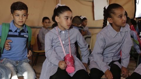 Jana Zawahra (c) attends class in a tent after her school was demolished in Jub El-Thib.