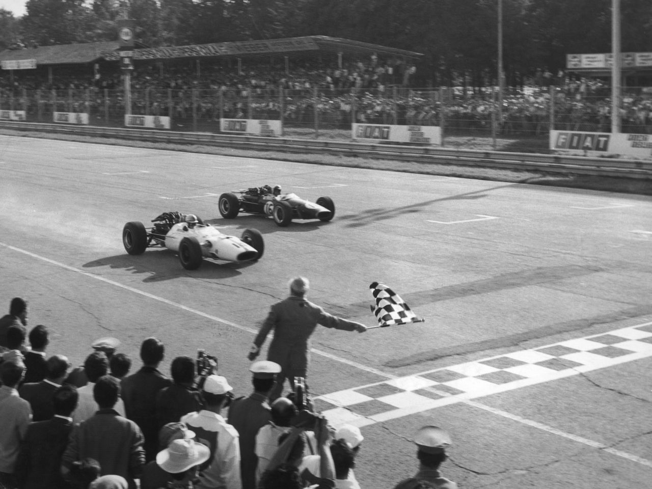 Surtees (left) won the Italian Grand Prix twice in 1964 and 1967 (pictured).