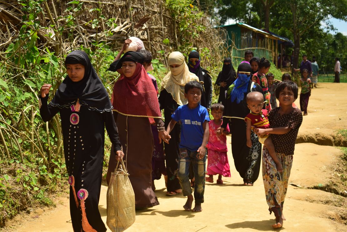Amena Khatun (second from left) and her family enter Balukhali camp in Cox's Bazar. 