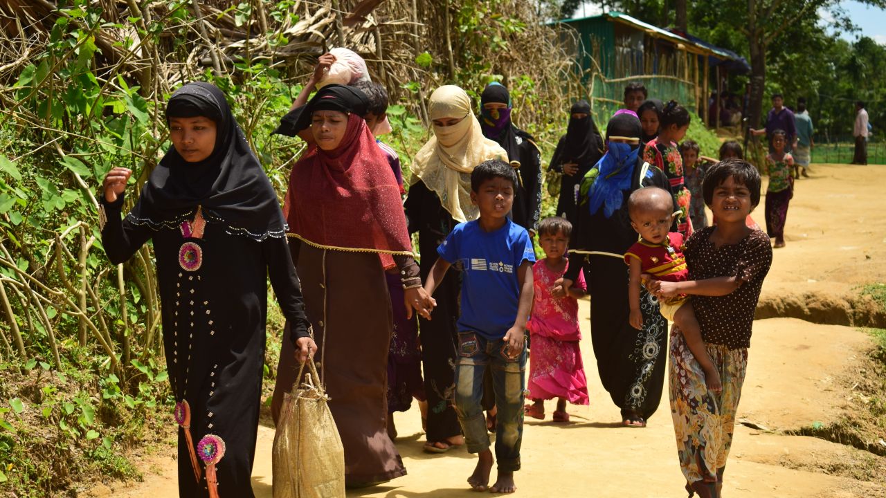 Amena Khatun (second from left) and her family enter Balukhali camp in Cox's Bazar. 