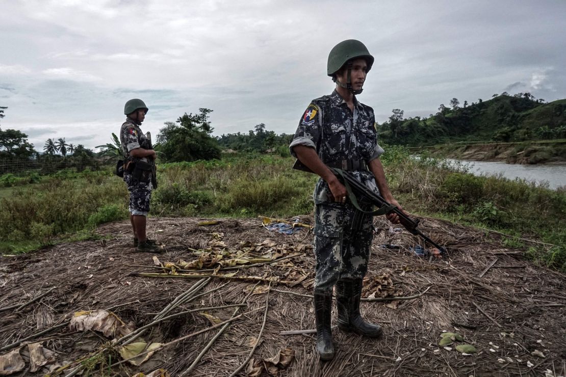Border police standing guard at Tinmay village, Buthidaung township in Myanmar's northern Rakhine state.