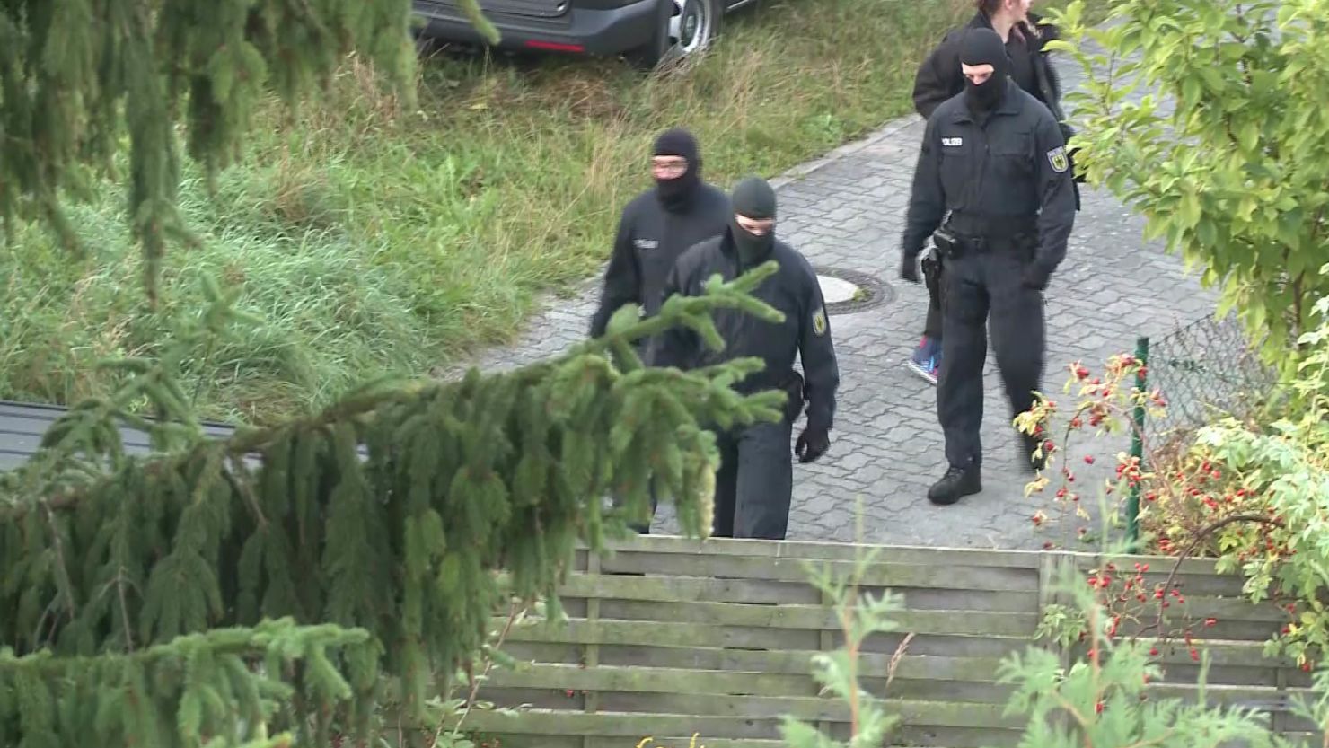 Authorities raid a property in northern Germany on Monday. 