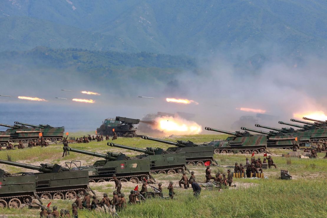 Photo released by North Korea's official Korean Central News Agency shows rockets being launched by Korean People's Army (KPA) personnel during a target strike exercise at an undisclosed location in North Korea.