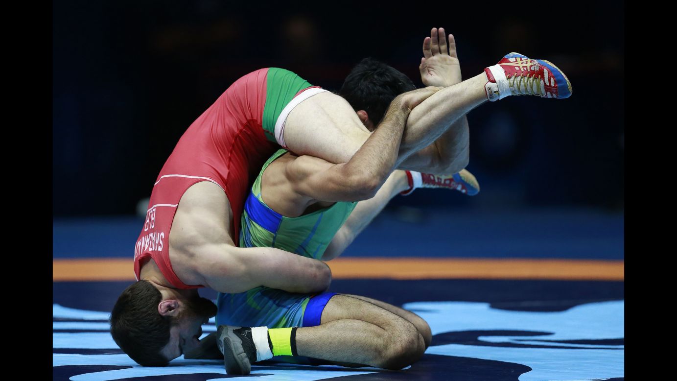Belarusian wrestler Ali Shabanau, left, competes against Uzbekistan's Bekzod Abdurakhmonov during the World Wrestling Championships on Saturday, August 26. Shabanau won the match to earn a bronze medal in their weight class.