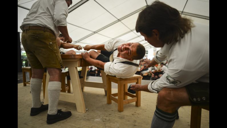 Competitors face off in the German Finger Wrestling Championships on Sunday, August 27. In the event, opponents sit at a table and try to pull each other's fingers toward each other's side.