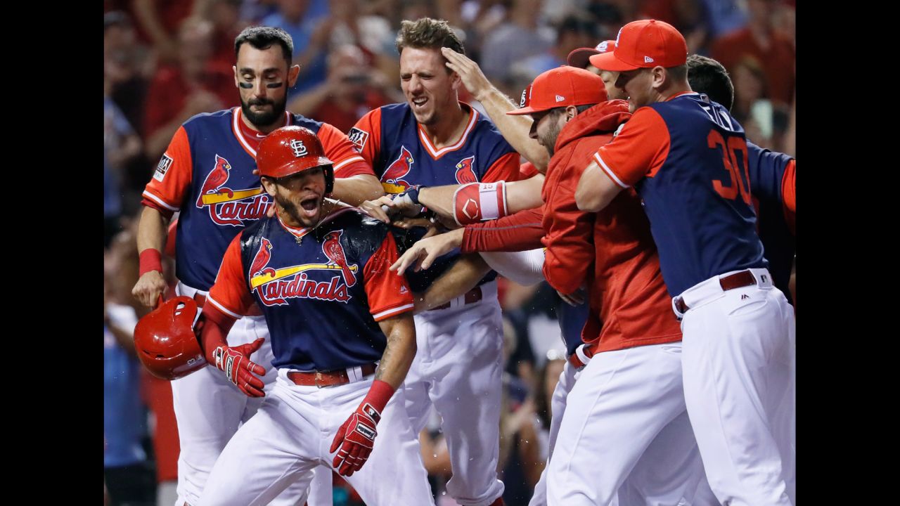 St. Louis' Tommy Pham is congratulated by teammates after hitting a walk-off home run against Tampa Bay on Saturday, August 26.