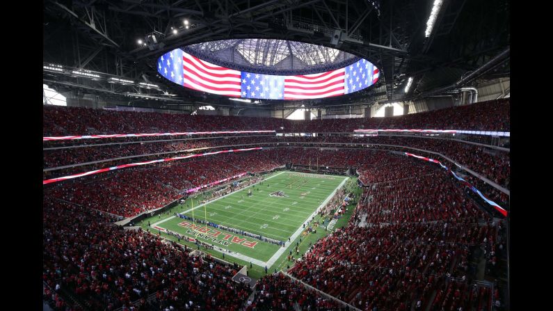 The national anthem is played before an NFL preseason game in Atlanta on Saturday, August 26. It was the first time the Falcons were playing at their new Mercedes-Benz Stadium. <a href="index.php?page=&url=http%3A%2F%2Fwww.cnn.com%2F2017%2F08%2F22%2Fsport%2Fgallery%2Fwhat-a-shot-sports-0822%2Findex.html" target="_blank">See 24 amazing sports photos from last week</a>