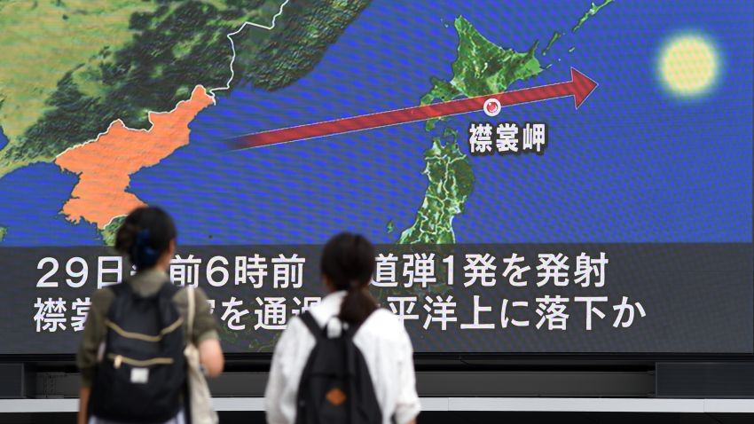 Pedestrians watch the news on a huge screen displaying a map of Japan (R) and the Korean Peninsula, in Tokyo on August 29, 2017, following a North Korean missile test that passed over Japan.
Japanese Prime Minister Shinzo Abe said on August 29 that he and US President Donald Trump agreed to hike pressure on North Korea after it launched a ballistic missile over Japan, in Pyongyang's most serious provocation in years. / AFP PHOTO / Toshifumi KITAMURA        (Photo credit should read TOSHIFUMI KITAMURA/AFP/Getty Images)