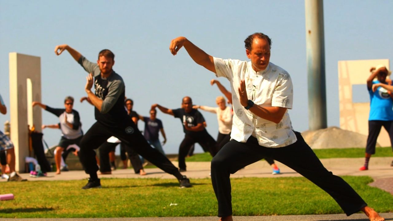 Daniel Hoover teaches a free tai chi class on a hilltop in Long Beach, California.