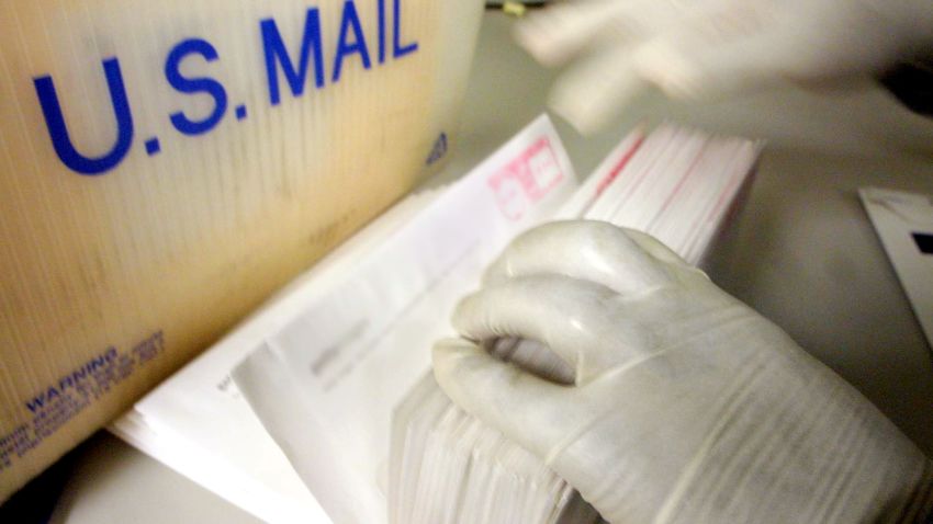 NEW YORK - OCTOBER 15, 2001: (SEPTEMBER 11 RETROSPECTIVE)  A corporate mailroom employee uses gloves while sifting through letters October 15, 2001 in New York City. Recent reports of anthrax in the mail have caused procedural changes in mailrooms throughout the country. (Photo by Mario Tama/Getty Images)