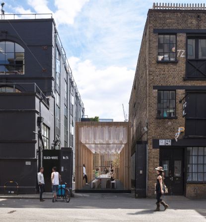 A gap between two buildings in East London will be filled by a pavilion created by Universal Design Studio and The Office Group as a place for collaborative creativity. Visitors will be invited to assemble hundreds of paper forms that will be integrated into the architecture of a space used to host events and workshops throughout the week.