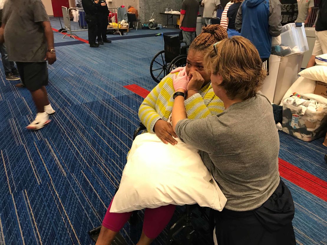 Harvey evacuee Karen Preston cries after being given a blanket and pillow at the Houston convention center.