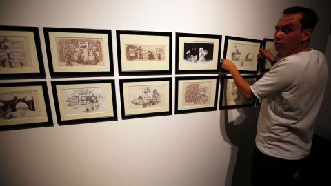 Cartoons by Naji al-Ali on display at the Palestinian Museum on August 26 in the West Bank town of Birzeit, near Ramallah.
