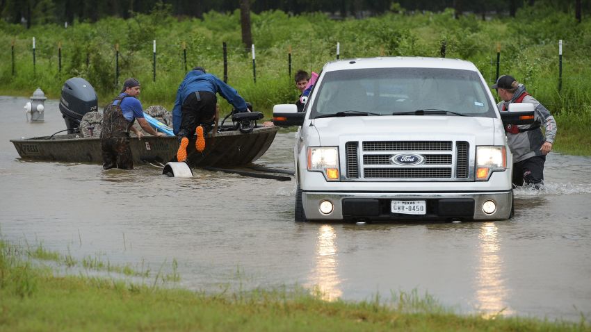Civilian rescuers put their boat in the water on a flooded road to search for survivors in the aftermath of Hurricane Harvey in Cypress, Texas on August 29, 2017.Hurricane Harvey has set what forecasters believe is a new rainfall record for the continental United States, officials said Tuesday. / AFP PHOTO / MANDEL NGAN        (Photo credit should read MANDEL NGAN/AFP/Getty Images)