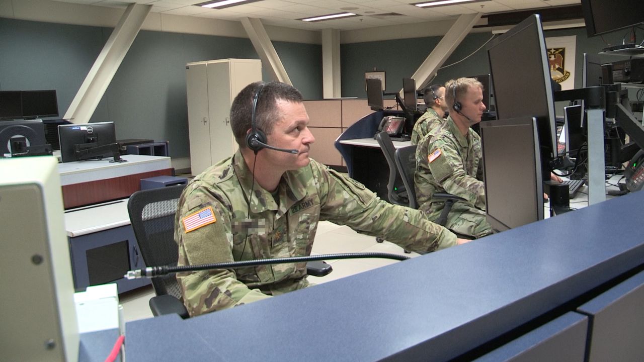 National Guard soldiers participate in a drill inside the Fire Direction Center. The name tag of one of the officers pictured here has been obscured for security reasons. 