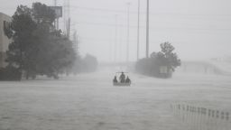 Members of the Texas Border Patrol bring their boat back to the launch site near Deerbrook Mall, on FM 1960, after currents were too rough to transport an elderly woman, needing rescue from behind the mall, as heavy rains continued falling from Tropical Storm Harvey, Tuesday, Aug. 29, 2017, in Humble, Texas. (Karen Warren/Houston Chronicle via AP)