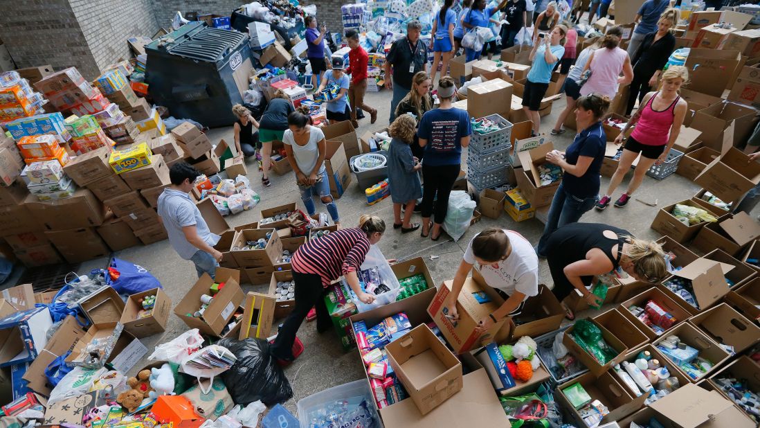 Volunteers in Dallas organize items donated for hurricane victims.