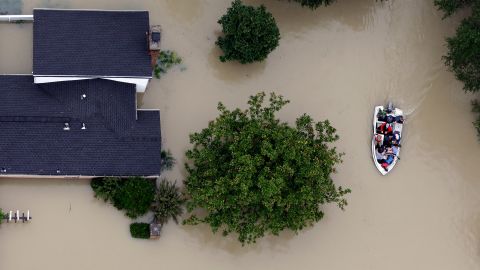 Residents evacuate their homes near Houston's  Addicks Reservoir on Tuesday.