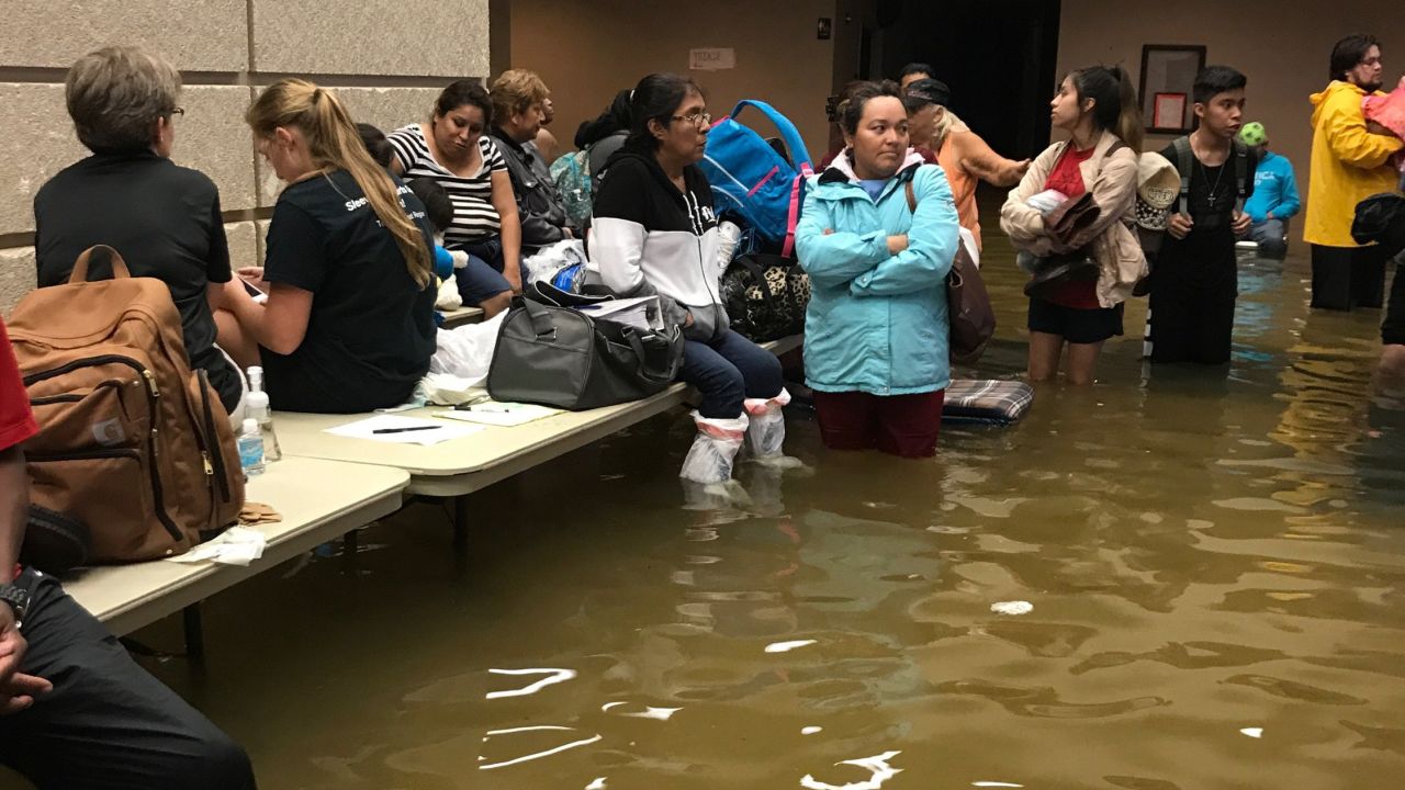 Evacuees at a Port Arthur emergency shelter battle flooding once more after leaving their homes.