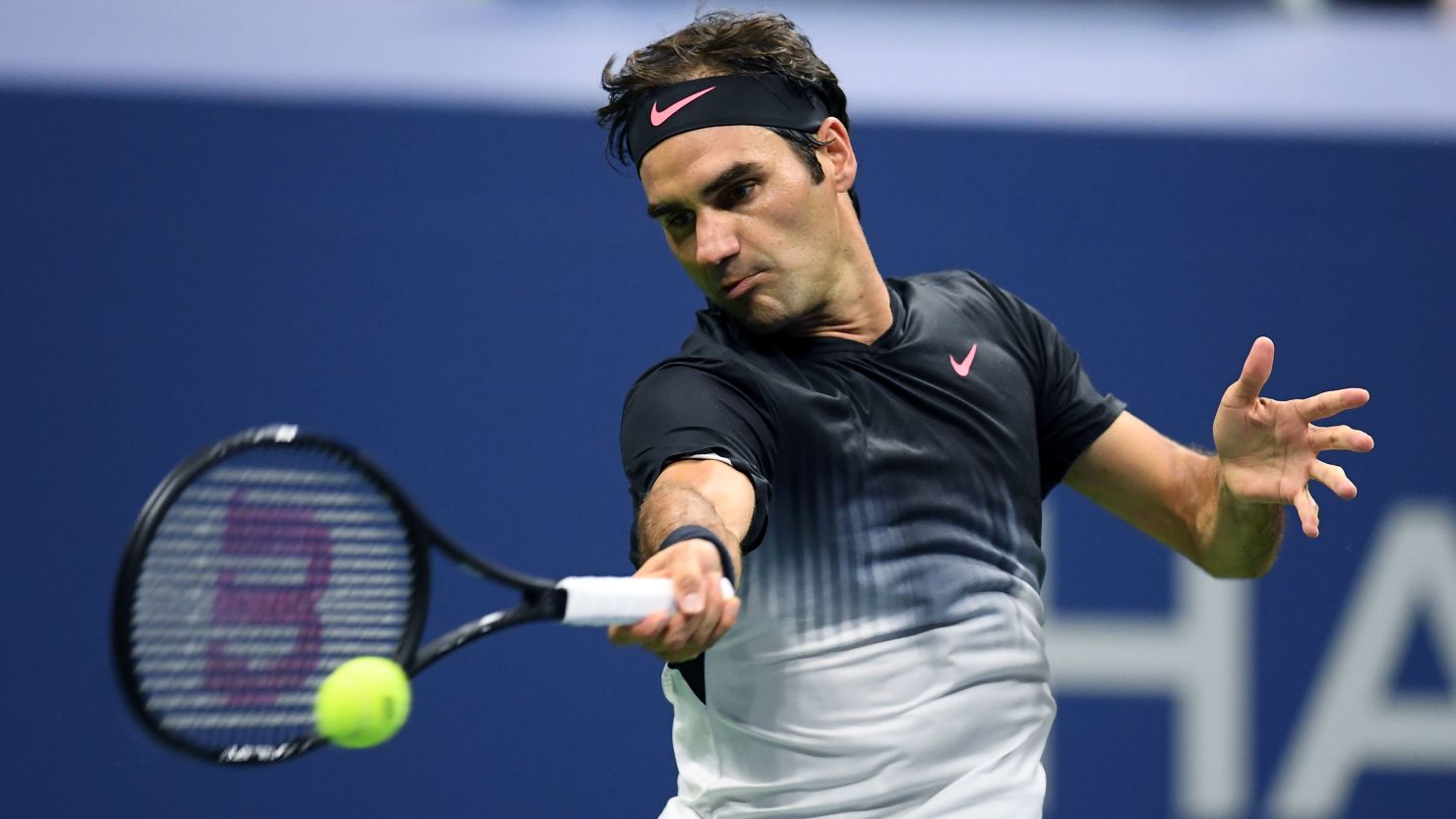 Switzerland's Roger Federer returns the ball to Frances Tiafoe of the US during their 2017 US Open men's singles match.
