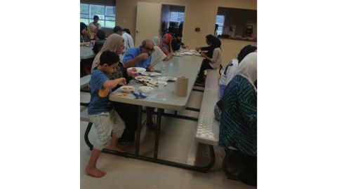 Evacuees eat at the Brand Lane Islamic Center in Stafford, Texas, which served as a Hurricane Harvey shelter.