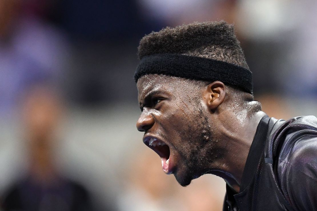 Tiafoe wins a point against Federer during their first round match.