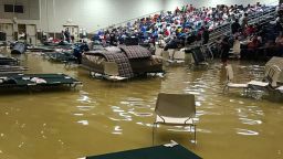 In this photo provided by Beulah Johnson, evacuees sit in the bleachers at the Bowers Civic Center in Port Arthur, Texas, Wednesday, Aug. 30, 2017, after floodwaters caused by Tropical Storm Harvey inundated the facility overnight. Authorities said it's not clear where the evacuees will go. (Beulah Johnson via AP)