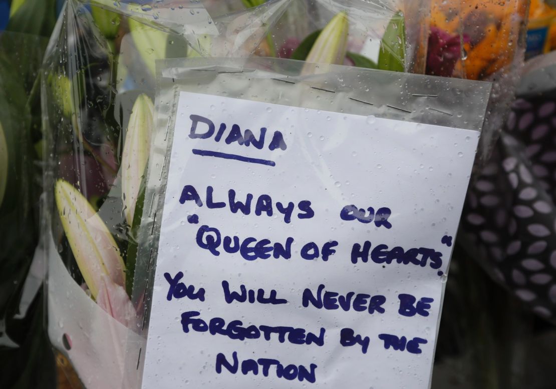 A tribute is attatched to the gates of Kensington Palace in London on Wednesday.
