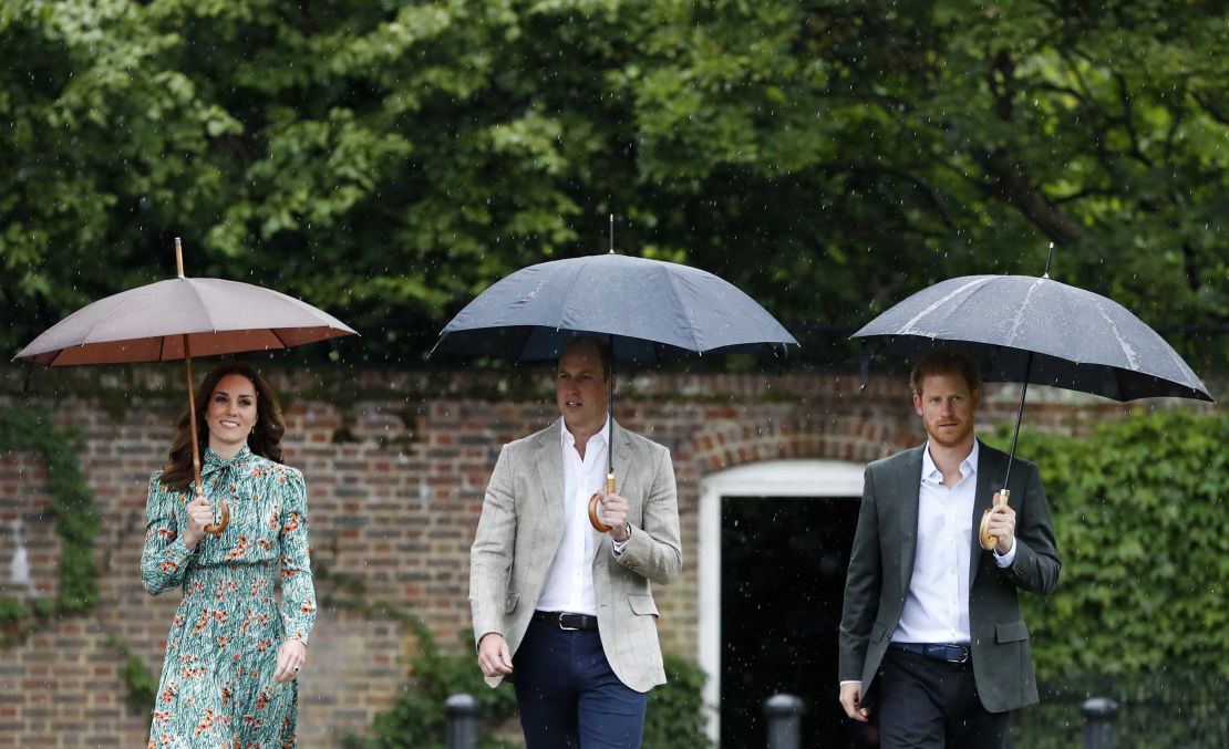 William, Harry and Catherine arrive at the White Garden at Kensington Palace, Princess Diana's home for 15 years, in London on Wednesday. The garden was planted to mark 20 years since her death.
