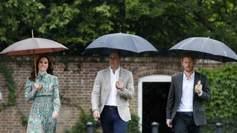 William, Harry and Catherine arrive at the White Garden at Kensington Palace, Princess Diana's home for 15 years, in London on Wednesday. The garden was planted to mark 20 years since her death. 